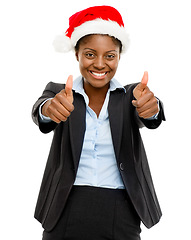 Image showing Merry Christmas from our company to yours. Studio shot of a confident young businesswoman wearing a Santa hat and showing thumbs up against a white background.