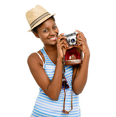 Image showing On a mission making memory. Studio shot of a young woman taking pictures with a camera while traveling against a white background.