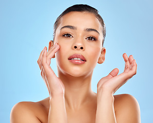 Image showing Skip the filter - feel the confidence. Studio portrait of an attractive young woman posing against a blue background.