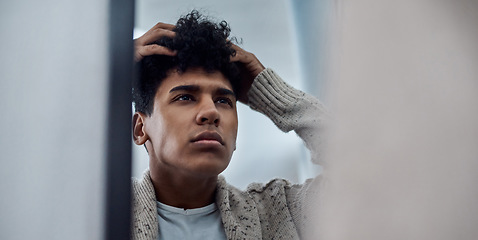 Image showing To fix your problem get to the root of it. a handsome young man inspecting his face in the bathroom mirror.