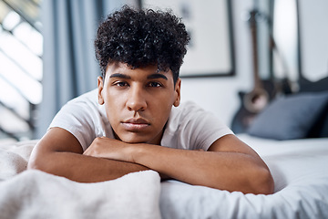 Image showing What are my plans Same as every other day. a young man lying on his bed and looking bored.