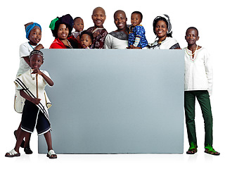 Image showing WE endorse family. Studio shot of a large african family holding a blank board, isolated on white.