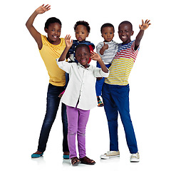 Image showing Bright and happy childhood. Studio shot of african children waving against a white background.