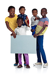 Image showing Weve got a message for the future. Studio shot of african children holding a blank board against a white background.