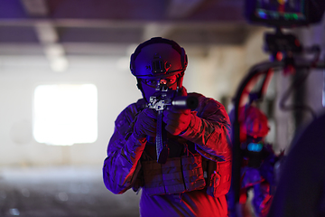 Image showing A professional cameraman captures the intense moments as a group of skilled soldiers embarks on a dangerous mission inside an abandoned building, their actions filled with suspense and bravery