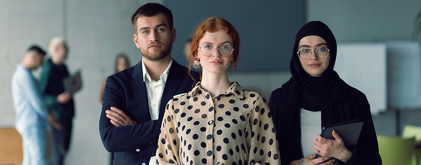 Image showing Wide crop photo of young business entrepreneurs engages in a lively discussion within the office, exemplifying the spirit of teamwork, innovation, and ambition in pursuit of success.