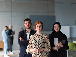 Image showing A group of young business entrepreneurs engages in a lively discussion within the office, exemplifying the spirit of teamwork, innovation, and ambition in pursuit of success.