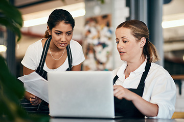 Image showing The smallest meetings can produce the biggest results. two women using a laptop together while working in a cafe.