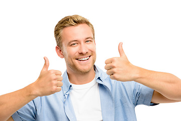 Image showing I like where this is going. a handsome young man standing alone in the studio and showing a thumbs up.