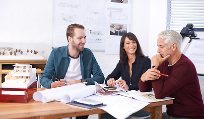 Image showing The architectural dream team. three architects working on a new building design.