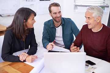 Image showing The architectural dream team. three architects working on a new building design.