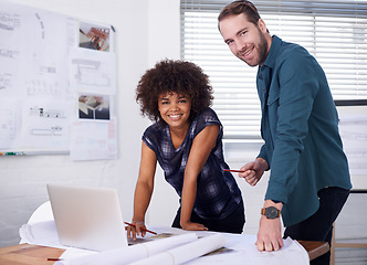 Image showing Theyre an innovative young team. Cropped portrait of two young architects working together on building plans.