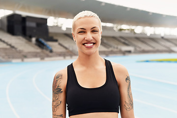 Image showing My sport keeps me happy. Cropped portrait of an attractive young female athlete standing outside at the track.