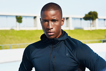 Image showing Im here to win. Cropped portrait of a handsome young male athlete standing outside at the track.
