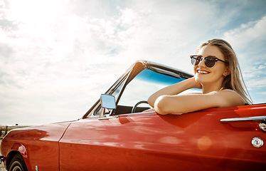 Image showing Memories are more important than things. a happy young woman enjoying a summer’s road trip.