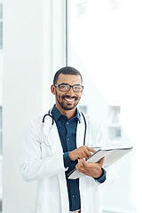 Image showing Medical information right at my fingertips. Portrait of a young doctor using a digital tablet in a modern hospital.