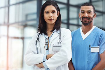 Image showing Here to give you the best care possible. Portrait of two confident young doctors working in a modern hospital.