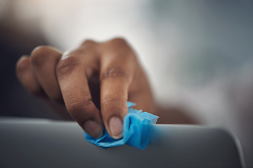 Image showing Be sure to continuously disinfect your office equipment. Closeup shot of an unrecognisable businesswoman cleaning a laptop in an office.