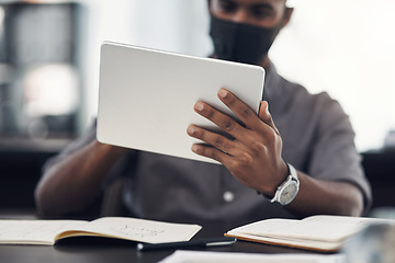 Image showing Using the latest apps to boost workplace performance. Closeup shot of an unrecognisable businessman using a digital tablet in an office.