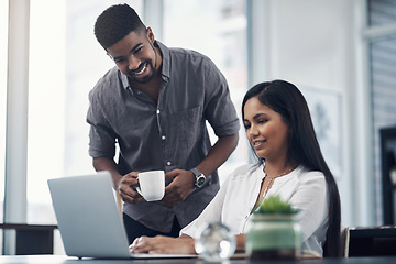 Image showing Working together to grow their business. two businesspeople working together on a laptop in an office.