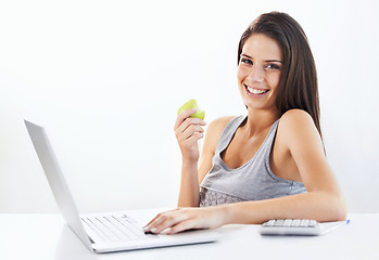 Image showing Portrait, laptop and woman nutritionist with apple in studio for wellness, diet or eating plan on white background. Weight loss, face and female health influencer with blog survey, help or menu guide