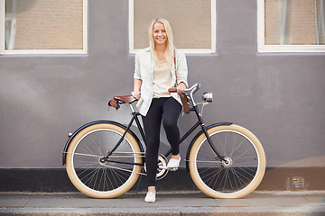 Image showing Travel, portrait and woman with a bicycle in a city street for vacation, trip or weekend freedom. Adventure, cycling and female person with a bike outdoor for eco transport, fun and exploring London