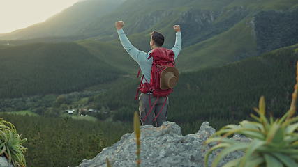 Image showing Man, celebration and mountains for hiking achievement, nature or view for trekking goal on vacation. Hiker guy, back and fist for winner, hill and fitness with exercise, success or cliff in Argentina