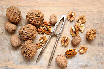 Image showing walnuts and nutcracker