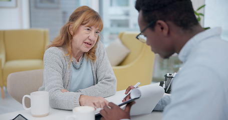 Image showing Talking, results and woman with black man or doctor for healthcare, insurance or checklist. Wellness, consulting and a senior patient speaking to an African clinic worker with a document for surgery