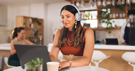 Image showing Laptop, freelance and woman in coffee shop with headphones, online research career and smile. Communication, technology and remote work, happy girl in cafe at computer, virtual assistant and internet