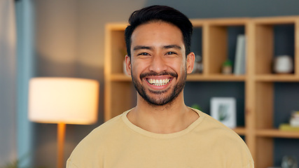 Image showing Happy, portrait and asian man in a living room at night with confidence, good mood and chilling in his home. Face, smile and Japanese male person in a house in the evening relax, cheerful or positive