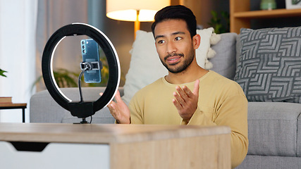 Image showing Influencer man, phone and ring light for live stream, web chat or recording in home living room. Content creator guy, video call or vlogger on smartphone, contact or communication in lounge at house