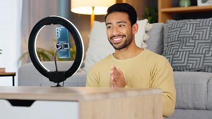 Image showing Influencer man, phone and ring light for talk, live stream or web chat in home living room. Content creator guy, video call or vlogger on cellphone, contact or recording in lounge, house or apartment