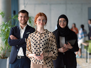 Image showing A group of young business entrepreneurs engages in a lively discussion within the office, exemplifying the spirit of teamwork, innovation, and ambition in pursuit of success.