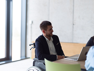 Image showing Closeup photo of a disabled person in a modern office at a productive meeting