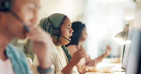 Image showing Call center woman, yawn and tired at computer, office or fatigue with team, customer service pr telemarketing. Muslim crm, burnout and overtime with tech support, help desk or consulting in workplace