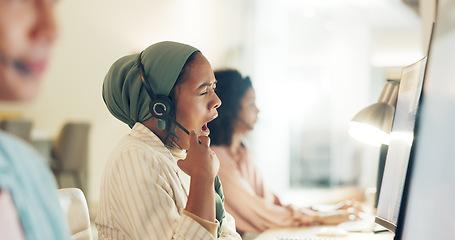 Image showing Call center woman, yawn and fatigue at computer, office or tired with team, customer service pr telemarketing. Islamic crm, burnout and overtime for tech support, help desk or consulting in workplace