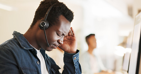 Image showing African call center man, headache and office for stress, pain or fatigue with fail in telemarketing job. CRM, agent or consultant with burnout, tired or mental health by computer for customer service