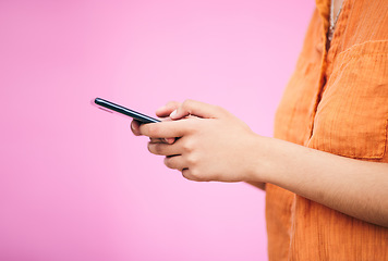 Image showing Phone, search and space with hands of woman for network, social media and communication. Contact, post and technology with closeup of person on pink background for gen z, mockup and mobile app