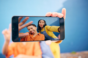 Image showing Selfie, screen and women in city on blue background for social media, online post and profile picture. Friendship, smile and female people with hand take photo for bonding, quality time and relax