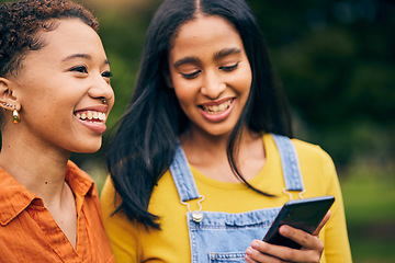 Image showing Phone, happy and women in park for social media, online post and laughing at meme outdoors. Friendship, mobile app and female people smile on smartphone for bonding, holiday and relaxing in nature