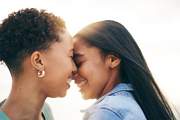 Image showing Lesbian couple, love and intimate outdoor at sunset, bonding and romance on date together. Happy, gay women and forehead touch for care, commitment and loyalty, trust and support for lgbtq people