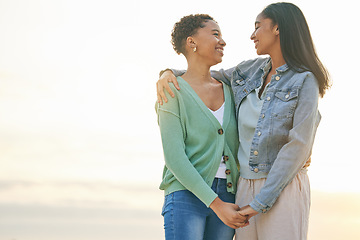 Image showing Love, beach and mockup, lesbian couple hug and holding hands together on sunset holiday adventure. Lgbt women, bonding and relax on ocean vacation with romantic date, pride and happy nature travel.