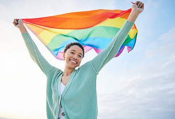 Image showing Woman, outdoor and rainbow pride flag in portrait with smile, wind and wave for lgbtq, inclusion and equality. African girl, fabric or cloth for human rights, lesbian sexuality and happy on vacation