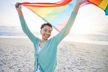 Image showing Woman, beach and pride flag for lgbtq in portrait, smile and wind with wave, rainbow and equality for inclusion. African girl, fabric or cloth for human rights, lesbian sexuality or happy on vacation