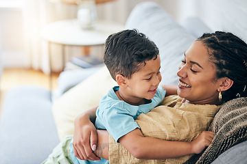 Image showing Smile hug and happy family mom, kid and home bonding for child security, support or care on lounge couch. Hugging, playing and excited mama, mum or woman laugh with young child in relax quality time