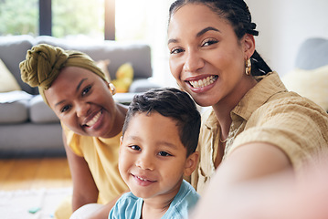 Image showing Lesbian, women and boy in family selfie, smile and care with portrait, post and web blog on floor in home living room. Mother, male kid and happy for love, bonding or memory for social media in house