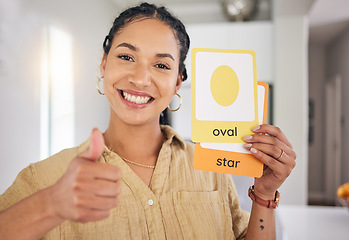 Image showing Happy woman, portrait and thumbs up with shape cards for education, success or good job at home. Face of female person or teacher smile with like emoji, yes sign or OK for visual learning approval