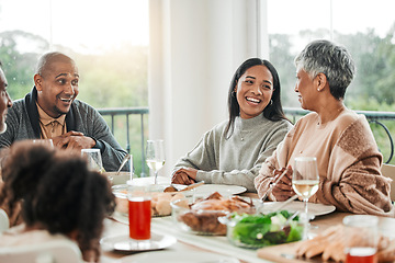 Image showing Smile, food and relax with big family in dining room for lunch, happy and holiday celebration. Thanksgiving, party and dinner with people laughing at table in home for nutrition, happiness and love