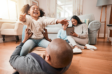 Image showing Happy, relax and playing with family on floor of living room for funny, support and freedom. Smile, happiness and youth with father and tickling child at home for care, trust and bonding together